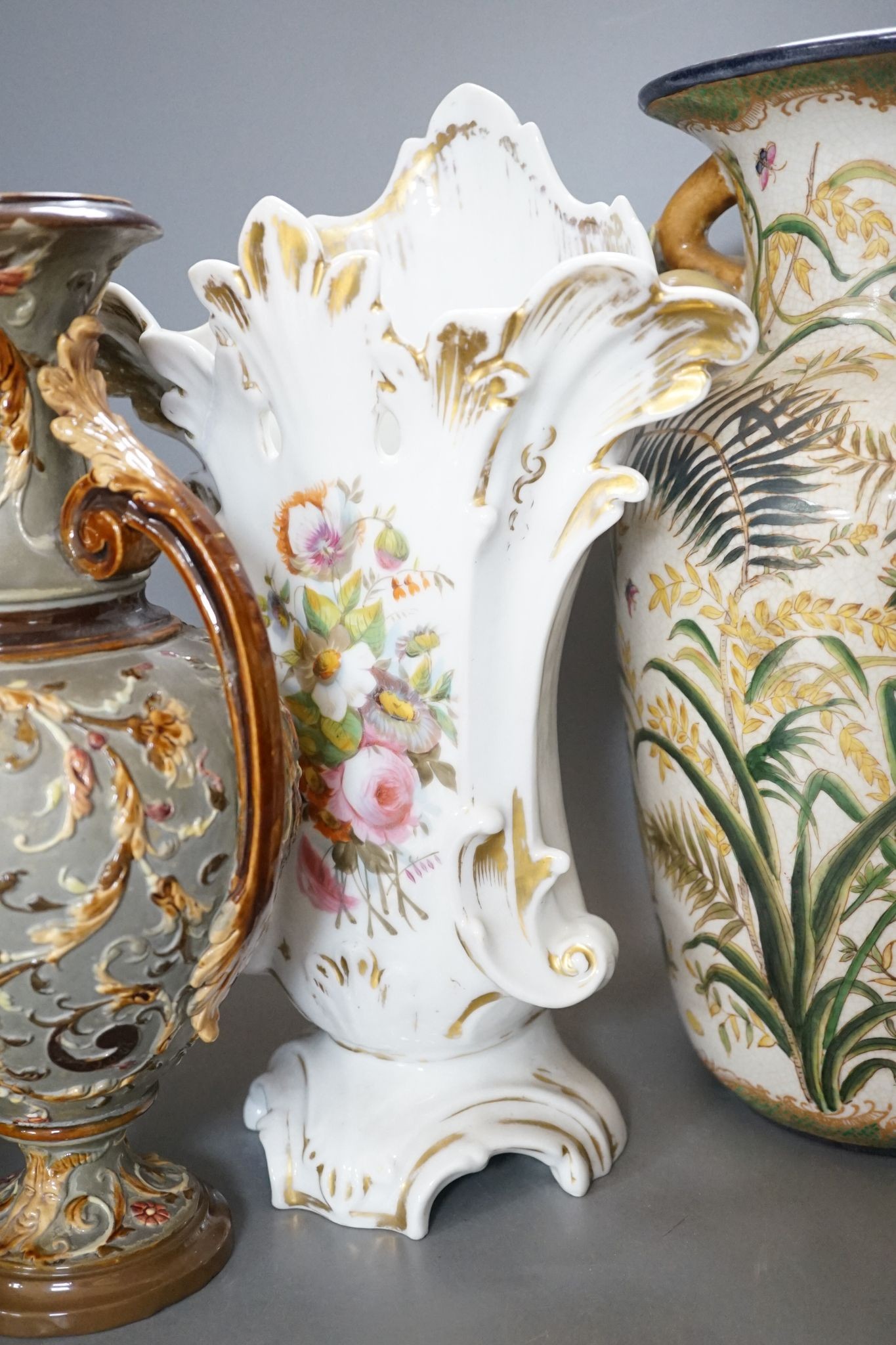 Four pairs of continental porcelain vases including a pair of Wilhelm Schiller & Sons vases